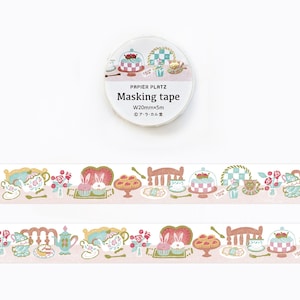 May include: A roll of masking tape with a whimsical design featuring cakes, teacups, and bunnies. The tape is 20mm wide and 5 meters long. The design is repeated along the tape's length, with a light pink background.