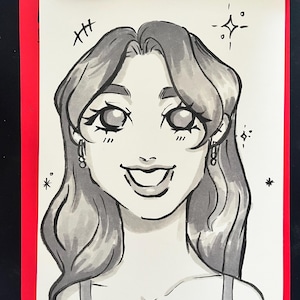 May include: A black and white ink drawing on paper featuring a portrait of a person with wavy hair, large expressive eyes, and a wide smile. The illustration includes small star accents and the signature N@cho in the bottom right corner.