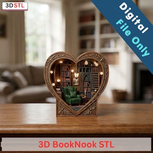 May include: A heart-shaped 3D book nook model featuring a miniature library interior with a green armchair, tall bookshelves, a hanging lantern, and small glowing lights. The frame has a decorative floral relief pattern. Text reads 3D STL and 3D BookNook STL.