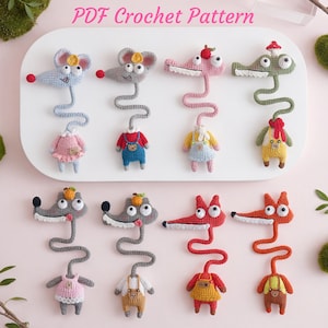 May include: A selection of crochet animal patterns, featuring mice, crocodiles, and foxes, each with a distinctive outfit. The image displays the text "PDF Crochet Pattern". The animals are in various colours, including pink, blue, and orange.