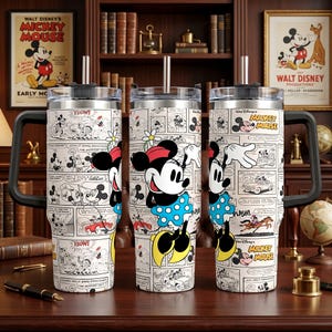 May include: A stainless steel tumbler with a handle and straw, featuring a black and white comic strip pattern of Mickey Mouse and Minnie Mouse. The design includes colorful accents on the characters and the text Mickey Mouse throughout the print.