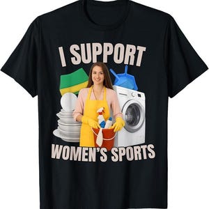 May include: Black t-shirt with the text "I SUPPORT WOMEN'S SPORTS" in white. The graphic includes a woman in a yellow apron, cleaning supplies, a washing machine, and a stack of white plates.