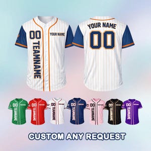 May include: White baseball jersey with orange pinstripes, blue sleeves, and the text "YOUR NAME" and "TEAMNAME". The jersey has the number "00" on the front and back. Below are examples in green, red, white, navy, pink, black, and purple.