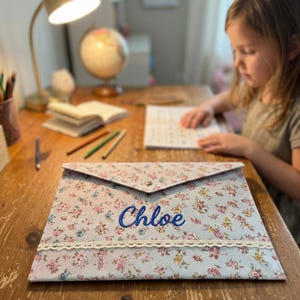 May include: A rustic wooden sign with the text "Welcome to our home" in white lettering. The sign features a distressed finish and a simple, inviting design, perfect for entryway decor.