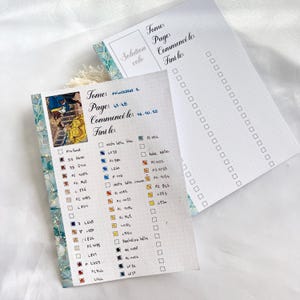 May include: Two open notebooks with a floral border. One page has a colorful illustration and a checklist with color swatches. The other page has a checklist with dotted lines. Text includes "Tome", "Page", "Commenc&eacute; le", and "Fini le".