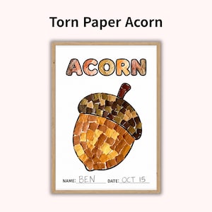 May include: A framed art print titled Torn Paper Acorn featuring a collage of brown, tan, and yellow torn paper pieces forming an acorn shape. The word ACORN is printed at the top. Below the acorn, the text reads NAME: BEN and DATE: OCT 15.