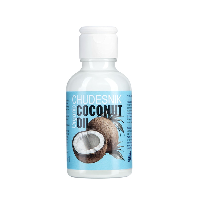 May include: A white bottle of organic coconut oil with a white cap. The label features the text "CHUDESNIK COCONUT OIL" and an illustration of a coconut. The bottle contains 100 ml of oil.