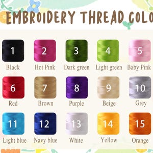 May include: A color chart titled EMBROIDERY THREAD COLOR displaying fifteen numbered spools of thread in various shades including black, hot pink, dark green, light green, baby pink, red, brown, purple, beige, grey, light blue, navy blue, white, yellow, and orange.