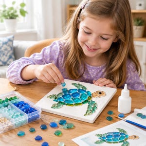 May include: A square white canvas featuring a sea turtle mosaic made of blue, green, and tan glass pieces. A plastic storage container filled with assorted glass pieces, a white glue bottle, and a printed reference image are present.