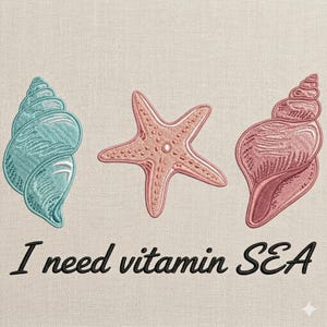 May include: Embroidered design featuring a teal seashell, a coral starfish, and a pink seashell. The phrase "I need vitamin SEA" is written in black script below the sea creatures. The design is on a beige fabric.