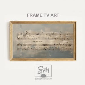May include: A framed artwork featuring sheet music against a muted blue and gray background. The gold frame surrounds the artwork, which has the text "FRAME TV ART" at the top. The Sunset Muse Art logo is at the bottom.