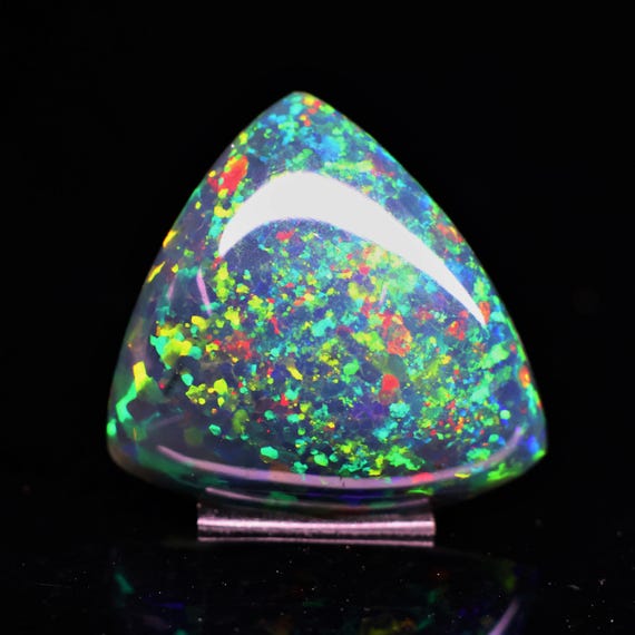 Natural Black Ethiopian Opal Trillion Cabochon, 19.10 Carat, Rainbow Fire Gemstone