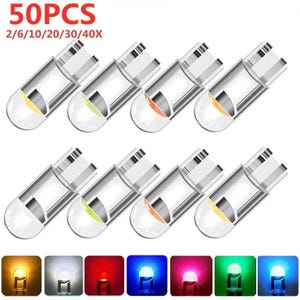 May include: A collection of small, clear LED bulbs with metal base connectors, arranged in two rows. The image includes text reading 50PCS and 2/6/10/20/30/40X. Below the bulbs are seven square icons displaying the lights in amber, white, red, blue, pink, green, and cyan.