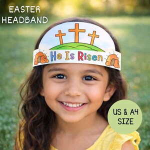 May include: An Easter headband with the text "He Is Risen" and three orange crosses on a green hill. The headband is white with a blue sky background and orange accents. The words "Easter Headband" are at the top.