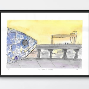 May include: Watercolour print featuring a large, blue mosaic fish head, bridge, and industrial cranes against a yellow sky. The black-framed print includes the text "The Salmon of Knowledge".
