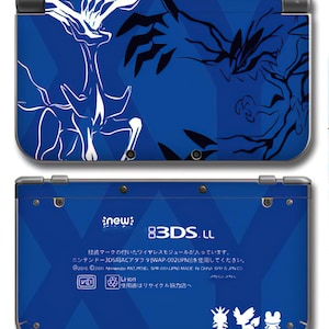 May include: A blue Nintendo 3DS LL console with a white and black graphic design on the top cover. The bottom cover has text and icons. The console has a new sticker.