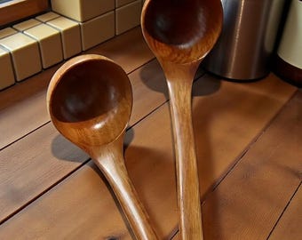 Handcrafted wooden ladle — a rustic, eco-friendly kitchen utensil and natural wooden soup spoon measuring 25 cm.