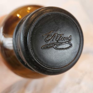 E. Merck Amber Glass Apothecary Bottle with Embossed Bakelite Lid - Mid-Century Pharmaceutical Collectible