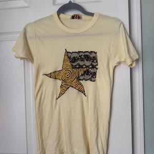yellow patchwork star tshirt with fabric paint spiral patch and vintage lace design!
