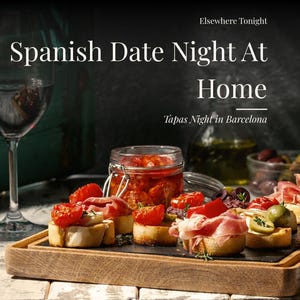 May include: A wooden tray holds tapas, including toasted bread topped with tomatoes, olives, and cured meats. A glass of red wine and a jar of preserved tomatoes are also visible. The text reads "Spanish Date Night At Home."