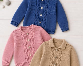 May include: Three knitted cardigans in blue, pink, and tan. The blue cardigan features a hood, while the pink and tan cardigans have collars. Each garment includes a central button closure, ribbed cuffs, and a vertical cable knit pattern.