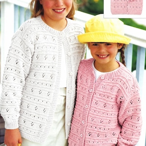 May include: Two long-sleeved knit cardigans featuring a repeating eyelet and vertical rib pattern. One cardigan is white and the other is pink. Both garments have a round neckline, a front button closure, and ribbed cuffs and hemline.