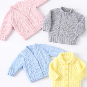 May include: Four knitted baby sweaters in pastel colors: pink, gray, blue, and yellow. The sweaters have different styles, including a cardigan and a collared button-up. Each sweater features a textured cable knit design.