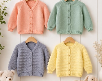 May include: Four long-sleeved knit cardigans hanging on wooden hangers. The top left is peach with a V-neck, the top right is sage green with a crew neck, the bottom left is periwinkle with a V-neck and textured stripes, and the bottom right is yellow.