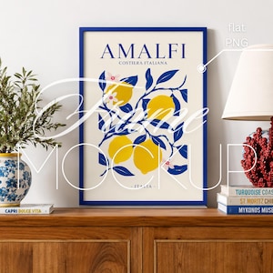 May include: A framed art print featuring the word "AMALFI" and "COSTIERA ITALIANA" in navy blue text. The artwork depicts yellow lemons and blue leaves on a cream background, with the word "ITALIA" at the bottom. The frame is navy blue.
