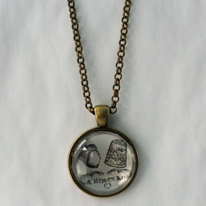 Thimble and Acorn Image Necklace - A Hidden Kiss in Antiqued Bronze and Brass Black and White