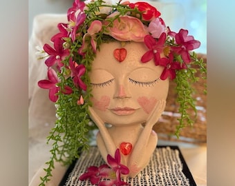 Art Floral Face Accent Art Piece with Silk Pink Flowers as Accents on Stand