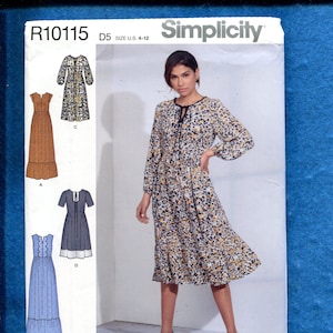 May include: Simplicity sewing pattern R10115 featuring a woman wearing a floral print dress. The pattern includes illustrations of various dress styles. The pattern is for U.S. sizes 4-12.