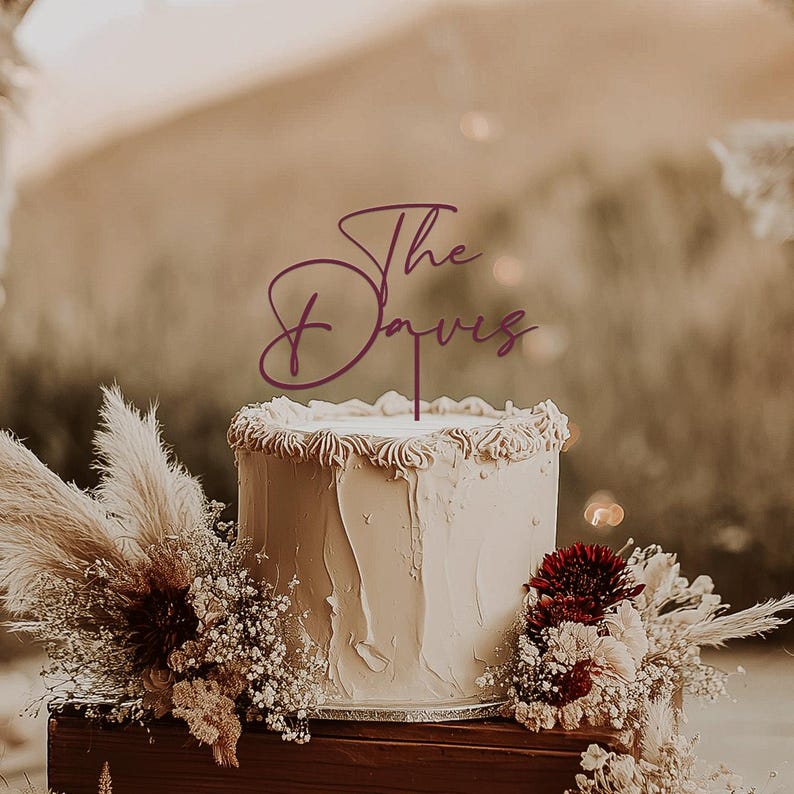 May include: A handmade wooden sign with the text "Welcome" in a playful font. The sign features a distressed white background and a dark brown frame, perfect for a front door or entryway. The sign measures approximately 12 inches wide and 6 inches tall.
