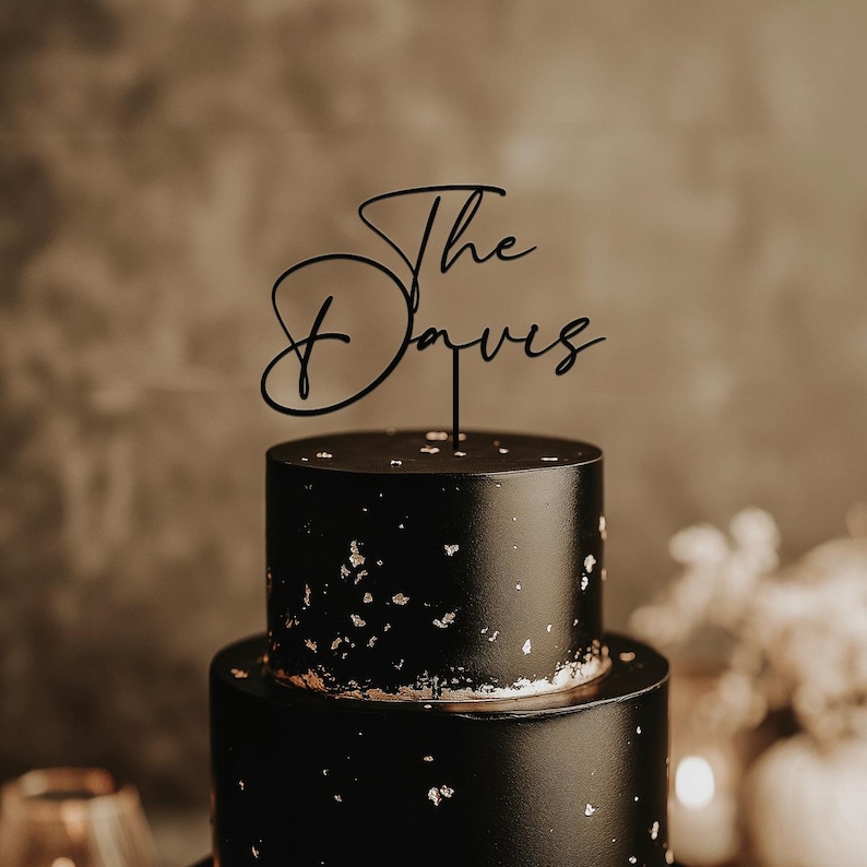 May include: A white ceramic mug with a black handle and the text "But First, Coffee" in a handwritten style. The mug is on a white surface. The mug is approximately 4 inches tall.