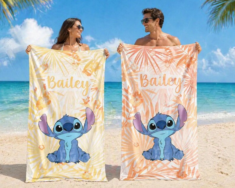 May include: Two beach towels with a cartoon character design. One is yellow with floral patterns, the other is orange. Both towels feature the name "Bailey". The towels are ideal for the beach or pool.