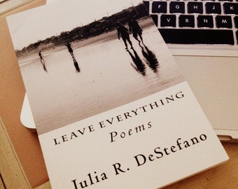 May include: A black and white photo of people walking on a beach is on the cover of a book titled "LEAVE EVERYTHING Poems Julia R. DeStefano".