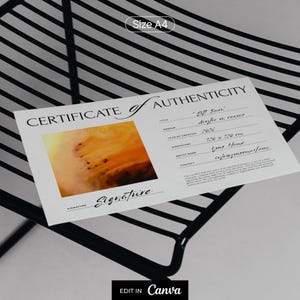 May include: A white A4 certificate of authenticity document featuring a rectangular orange and brown abstract painting thumbnail. The text includes fields for title, medium, year 2026, dimensions 120 x 120 cm, artist name, and contact information.