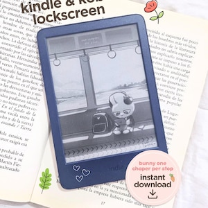 May include: A dark blue Kindle e-reader displaying a bunny-themed lockscreen image. The e-reader is resting on an open book. The image also includes a sticker that says "bunny one chaper per stop instant download".