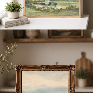 May include: A landscape painting in a gold ornate frame featuring a green valley, rolling hills, and a distant castle under a soft sky. The artwork depicts a serene countryside scene with muted tones of blue, green, and beige, presented in a classic style.
