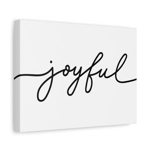 Może przedstawiać: Białe płótno z napisem "joyful" w czarnym, kursywnym skrypcie. Słowo jest wyśrodkowane i zajmuje większość przestrzeni płótna. Płótno jest prostokątne i ma czystą, nowoczesną estetykę.
