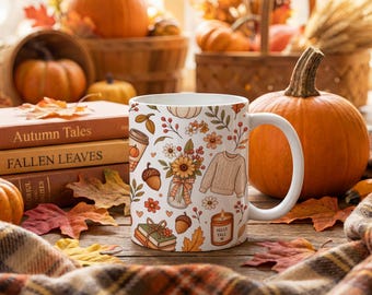 May include: A white ceramic mug featuring a repeating pattern of autumn-themed illustrations including sunflowers in a mason jar, a knit sweater, acorns, books, a coffee cup, and a candle with the text HELLO FALL printed on the front surface.