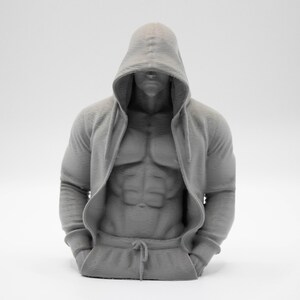 May include: A monochromatic gray 3D printed bust of a muscular torso wearing a hooded sweatshirt. The figure features a defined abdominal area, long sleeves, and a hood pulled over the head. The sweatshirt includes a front pocket and a drawstring.
