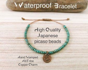 Lotus und Ohm Anhänger / Boho Style / Erdtöne / Kordelarmband / Wasserdicht / Gebetsarmband / Yoga-Schmuck / Surf-Schmuck