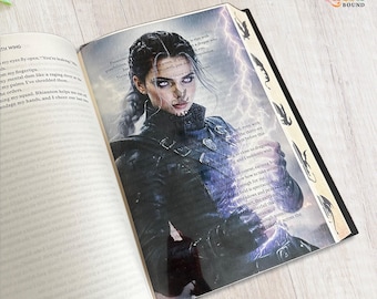 May include: An open book featuring a full-page illustration of a person with dark braided hair and glowing eyes, wearing dark armor. The image is overlaid with text and purple lightning effects. The page edge displays small black dragon silhouettes.