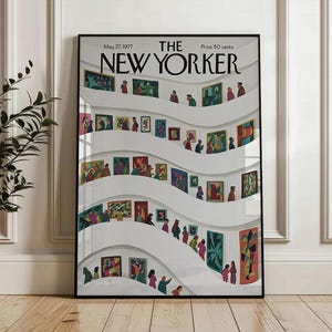 May include: A framed New Yorker magazine cover from May 27, 1977, featuring an art gallery scene. The illustration shows people viewing colorful paintings displayed on curved white walls. The magazine title is prominently displayed at the top.