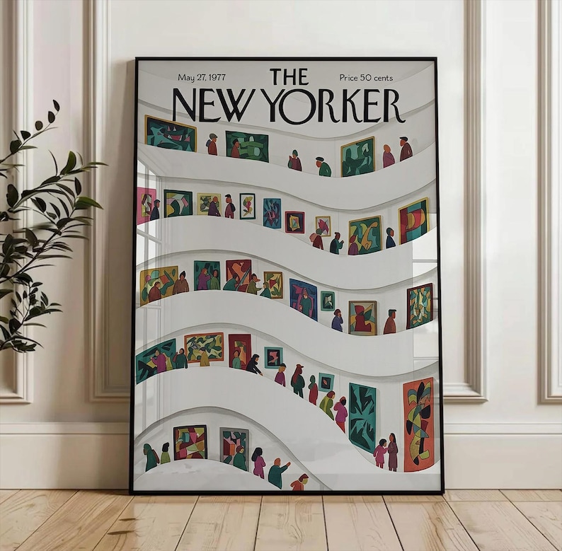 May include: A framed New Yorker magazine cover from May 27, 1977, featuring an art gallery scene. The illustration shows people viewing colorful paintings displayed on curved white walls. The magazine title is prominently displayed at the top.