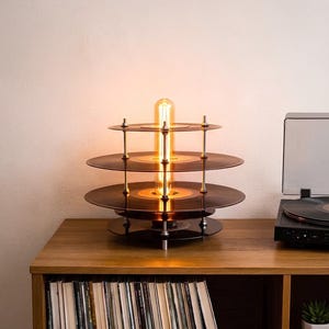 May include: A trio of ceramic mugs with a speckled, matte finish in cream, light grey, and dark grey. Each mug features a simple, minimalist design, ideal for tea or coffee.