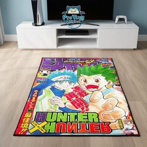 May include: A rectangular rug featuring a colorful manga illustration with the text "HUNTER X HUNTER" in green and red. The rug showcases two anime characters with blue and green hair, set against a vibrant background.