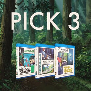 May include: Three Blu-ray movie cases with Japanese text and illustrations, featuring titles like "Castle in the Sky" and "Nausica&auml;." The text "PICK 3" is displayed in large white letters against a forest backdrop.