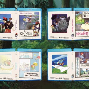 May include: Four Blu-ray cases featuring animated movie covers. Titles include "Kiki's Delivery Service," "My Neighbor Totoro," "My Neighbors the Yamadas," and "Nausica&auml; of the Valley of the Wind." Each case has a blue border and colorful artwork.